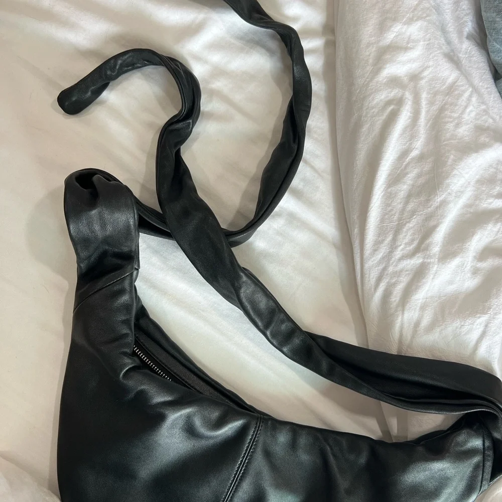 Maje “le bow bag” in black leather with silver studs